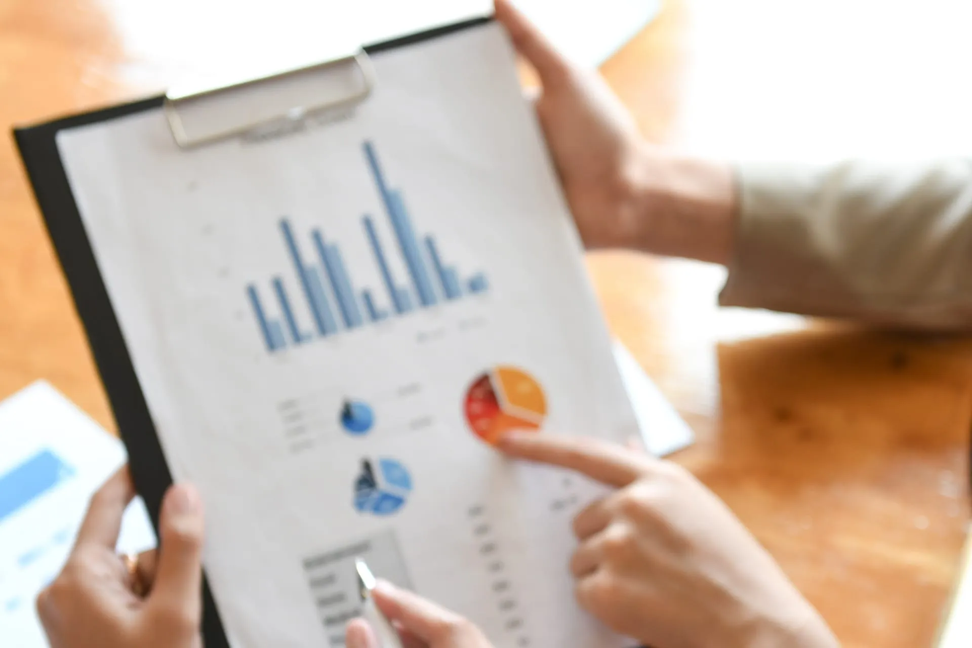 Bookkeeper holding a financial data sheet Clarion Accountancy & Taxation Oakham